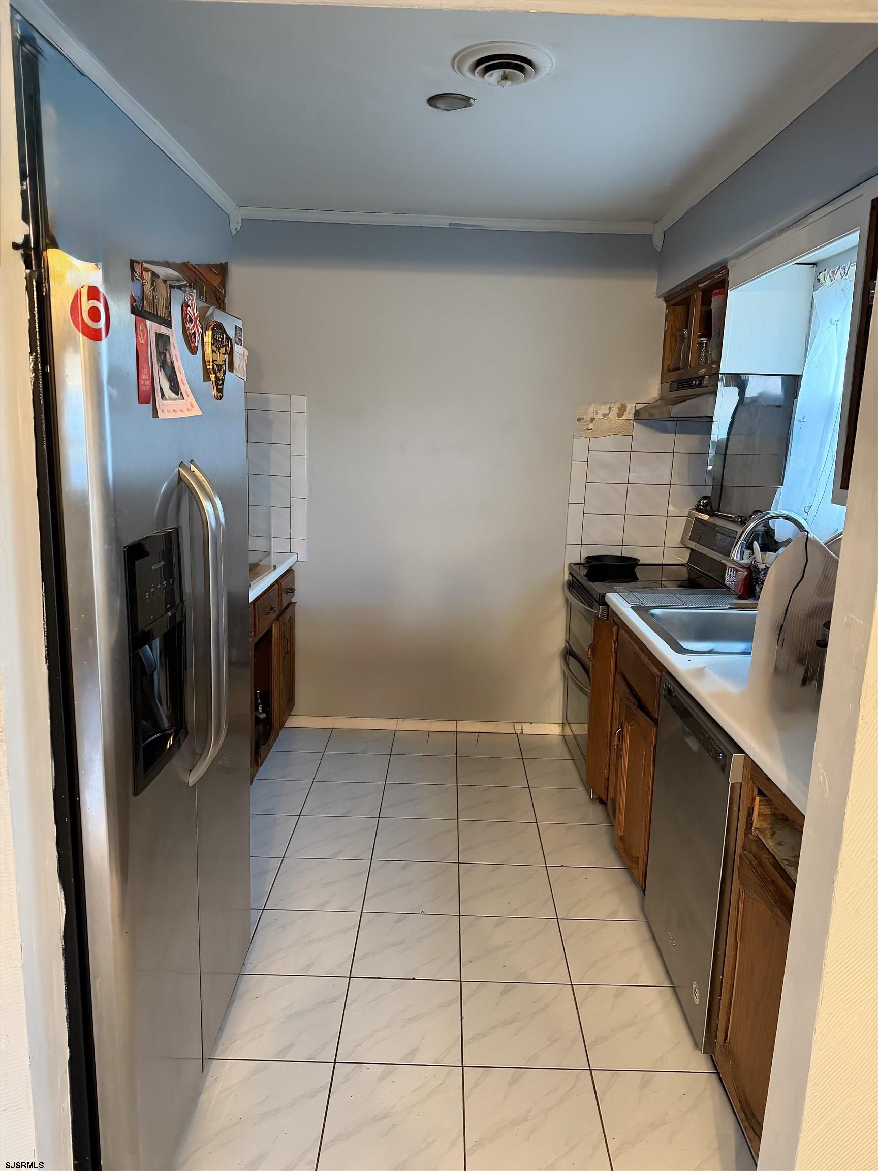 2530 Lexington Court Jackson, NJ 08527 - Photo 2 of 9 a kitchen with stainless steel appliances granite countertop a refrigerator and a stove