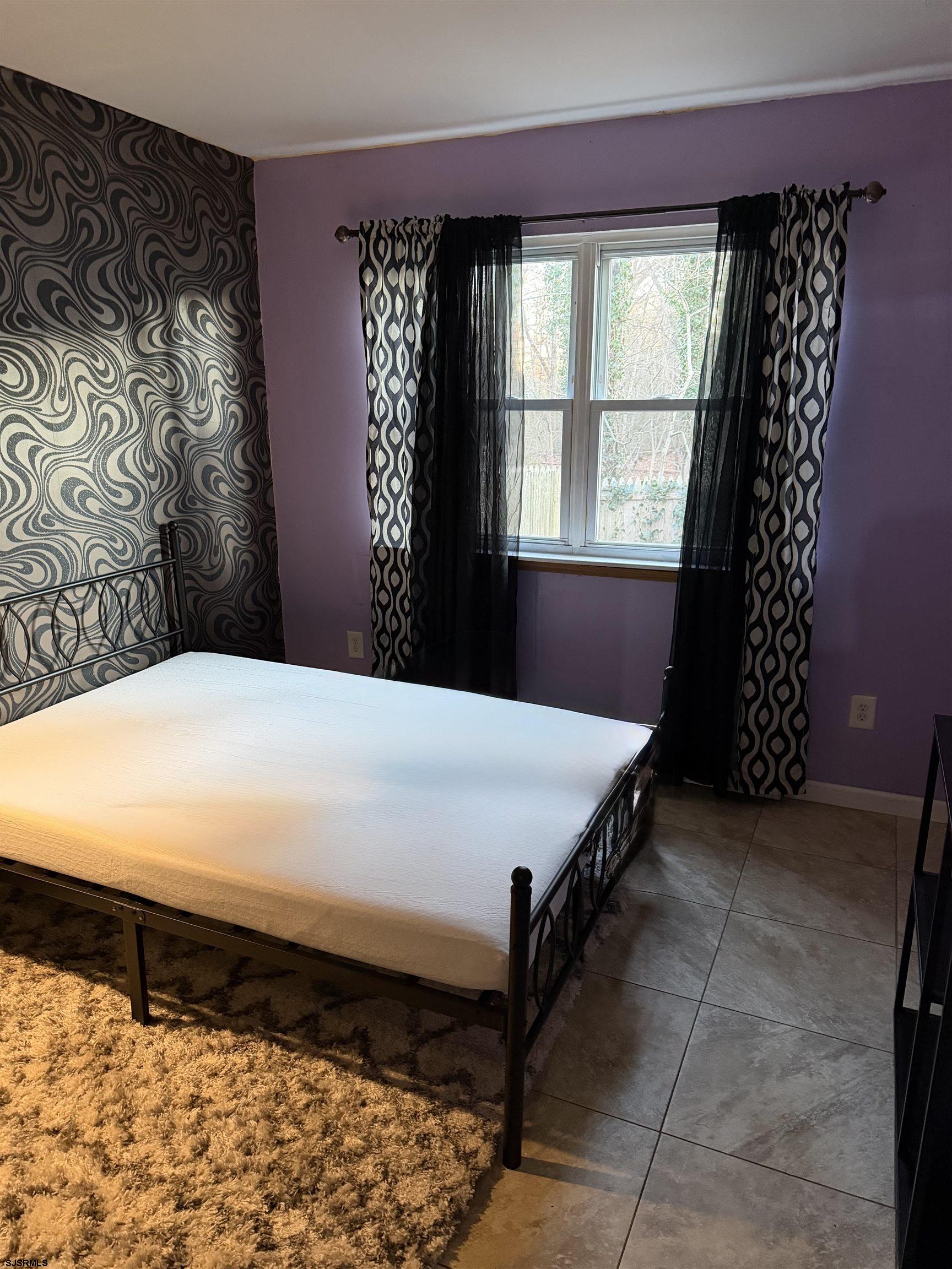 2530 Lexington Court Jackson, NJ 08527 - Photo 5 of 9 a bedroom with a bed and a window