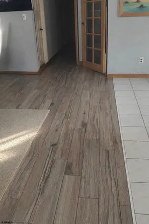 a view of wooden floor with entryway