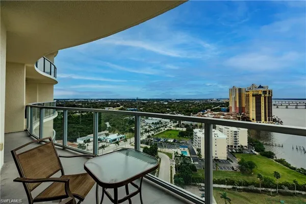 a view of a balcony with chairs