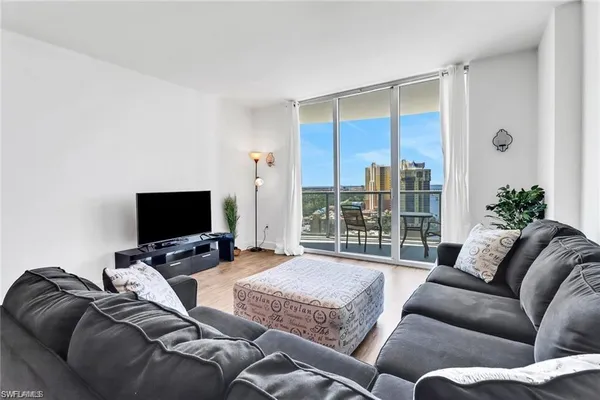 a living room with furniture and a flat screen tv