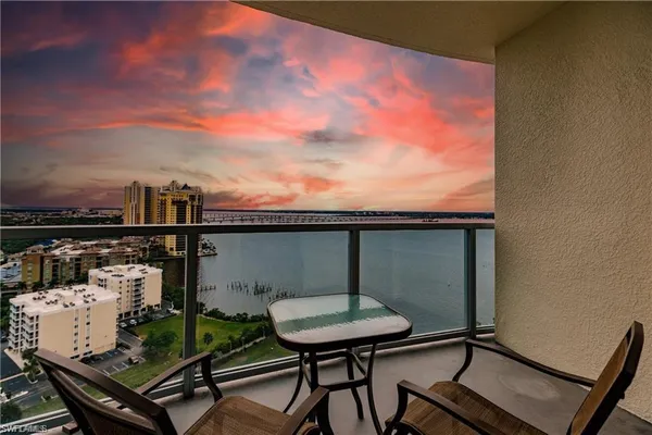 a view of a balcony with chairs