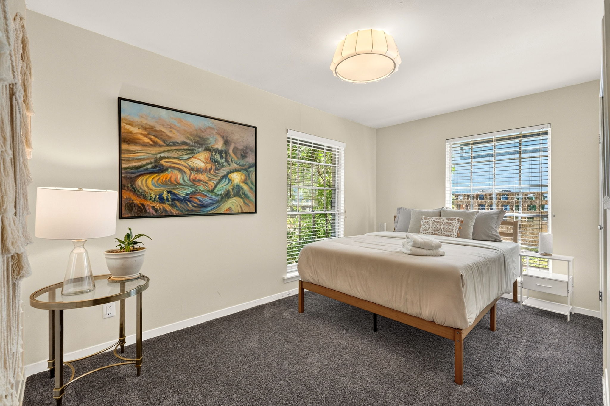 3604 Wilson Street Austin, TX 78704 - Photo 19 of 25 a spacious bedroom with a bed and a painting on the wall