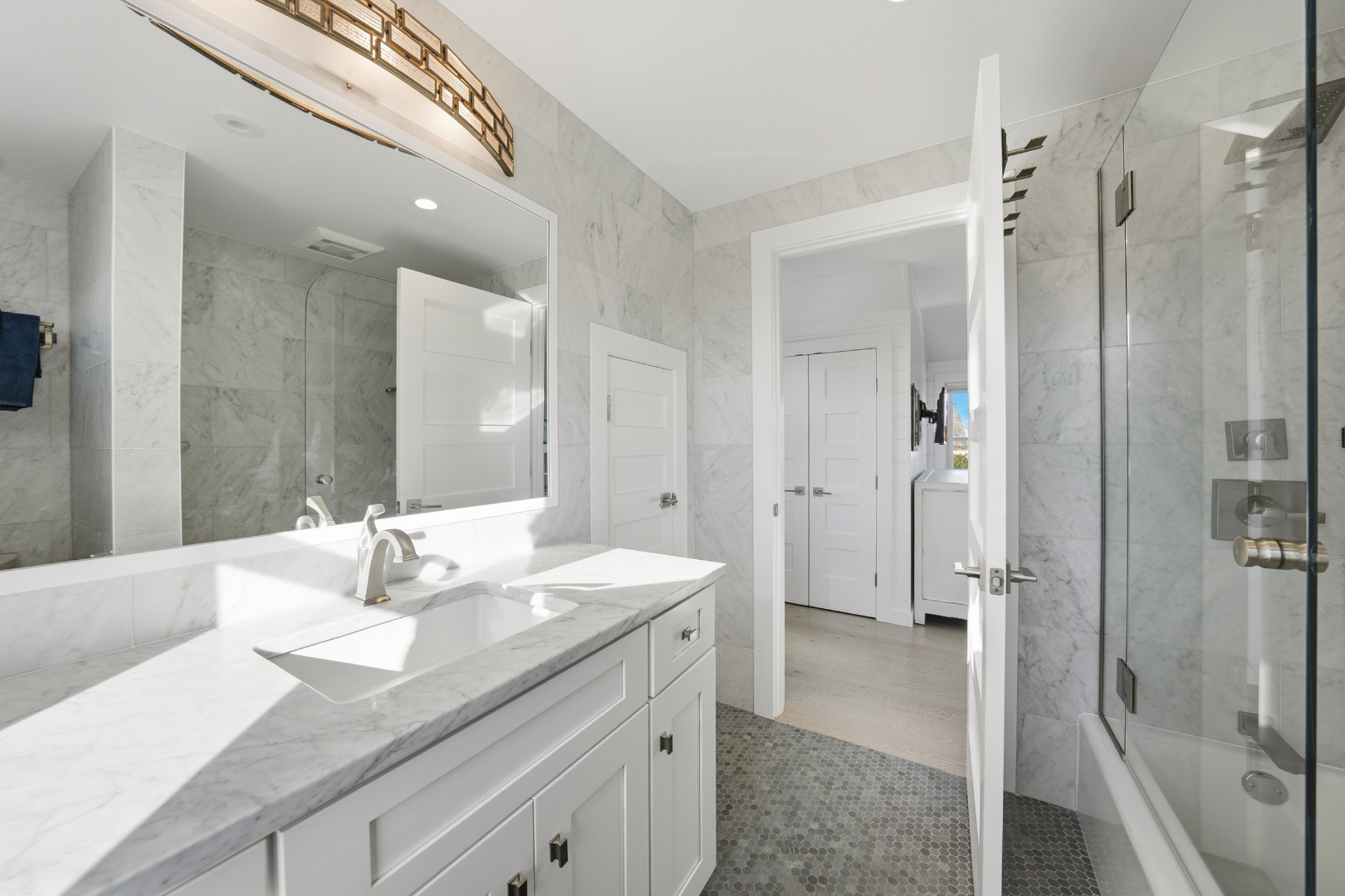 10 Pilgrim Road Nantucket, MA 02554 - Photo 45 of 65 a spacious bathroom with a granite countertop sink mirror and double