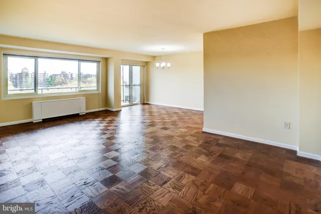 a kitchen with stainless steel appliances a sink stove and cabinets