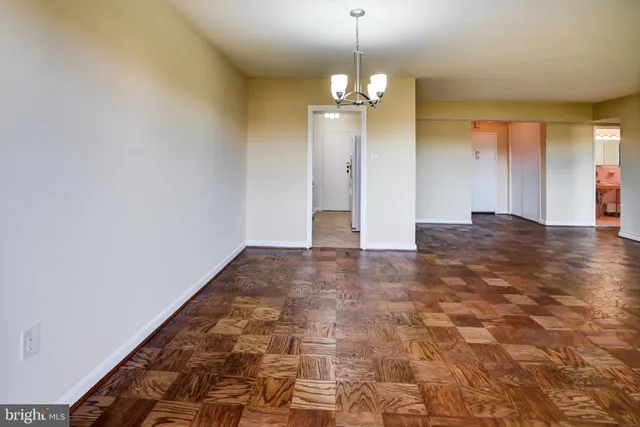 a kitchen with granite countertop a stove top oven microwave and cabinets