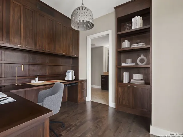 a kitchen with granite countertop stainless steel appliances and wooden cabinets