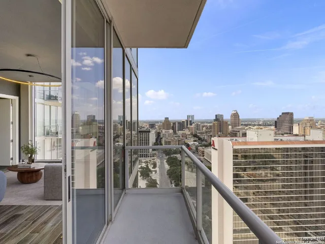 a view of a balcony with city view