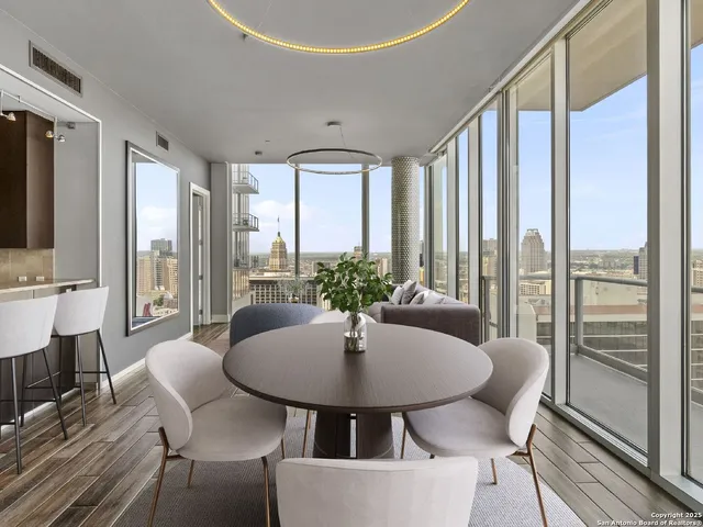 a view of a dining room with furniture window and outside view