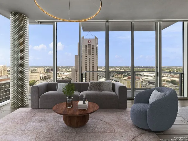 a living room with furniture and a large window