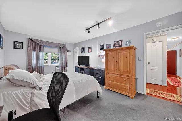 a bedroom with a bed and furniture