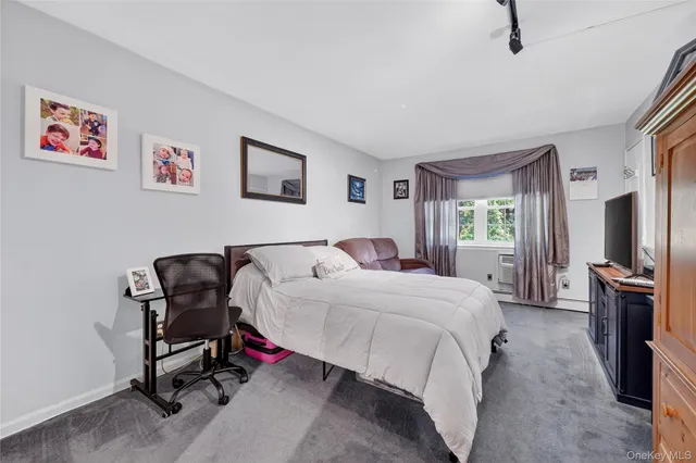 a bedroom with a bed and a chair