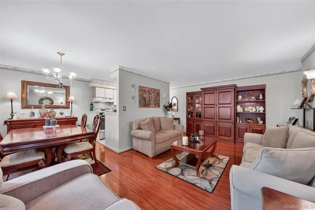 a living room with furniture a rug and a table