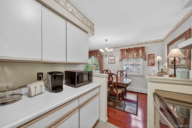 a view of a kitchen and dining room