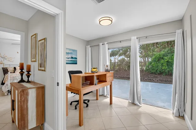 a work room with furniture and a gate