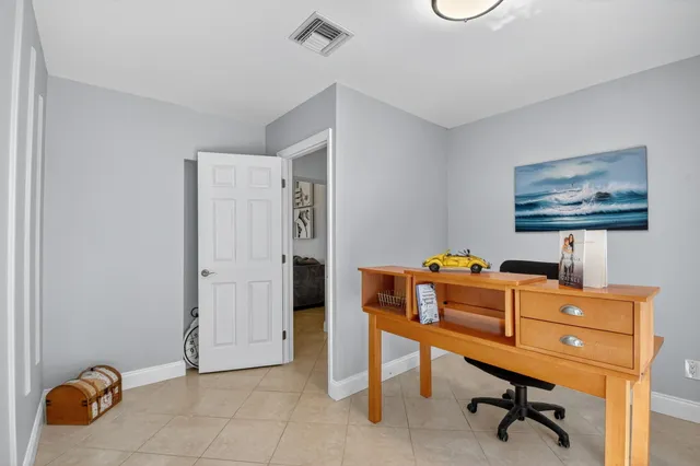 a view of a workspace with furniture