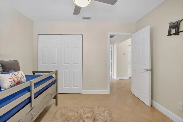 a room that has a bed and a dresser in it