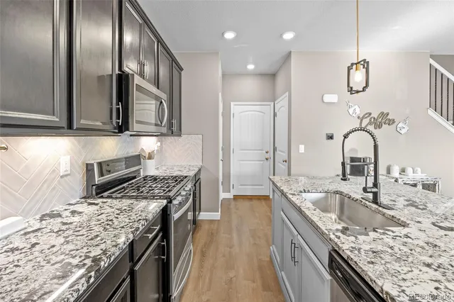 a view of a patio with a table and chairs