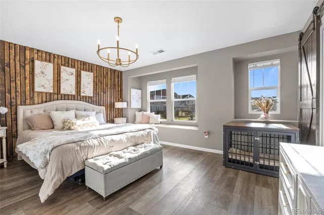 a bed room with a bed and a flat screen tv