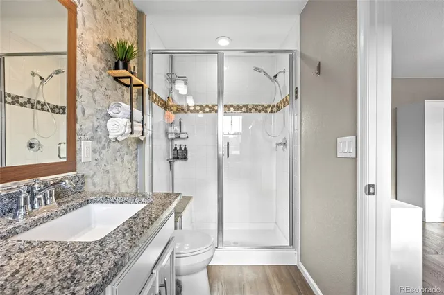 a spacious bedroom with a bed and a window