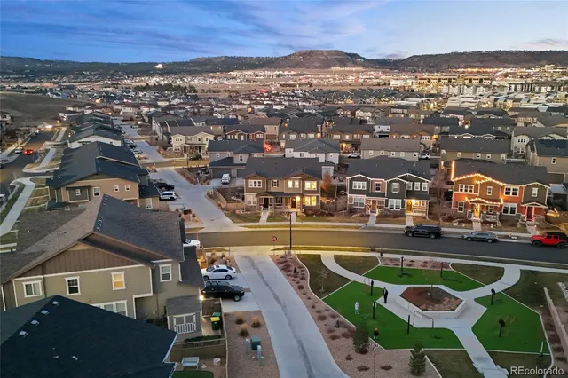 an aerial view of residential houses with outdoor space