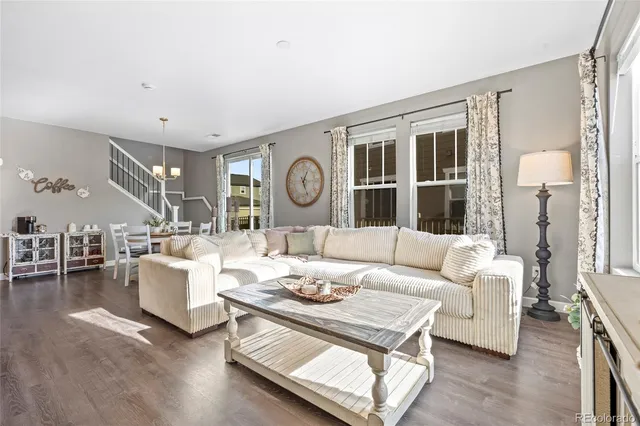 a view of a dining room with furniture and a large window