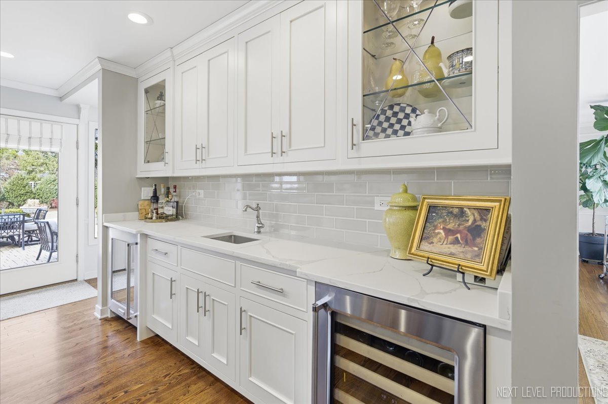 629 Peck Road Geneva, IL 60134 - Photo 11 of 38 a kitchen with stainless steel appliances cabinets and a window