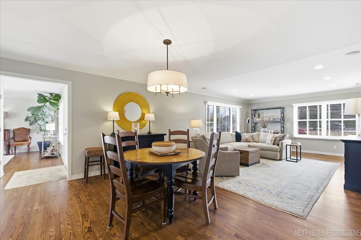 629 Peck Road Geneva, IL 60134 - Photo 12 of 38 a view of a dining room with furniture window and wooden floor