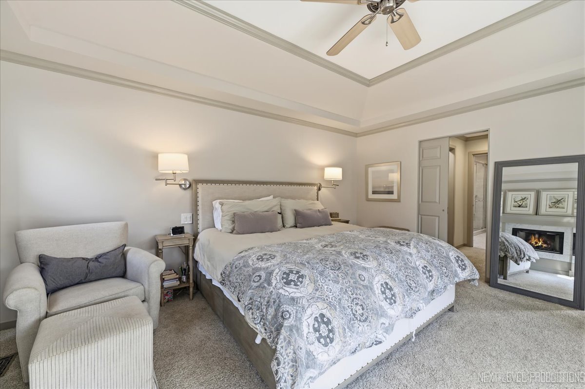 629 Peck Road Geneva, IL 60134 - Photo 18 of 38 a bedroom with a bed couch and ceiling fan