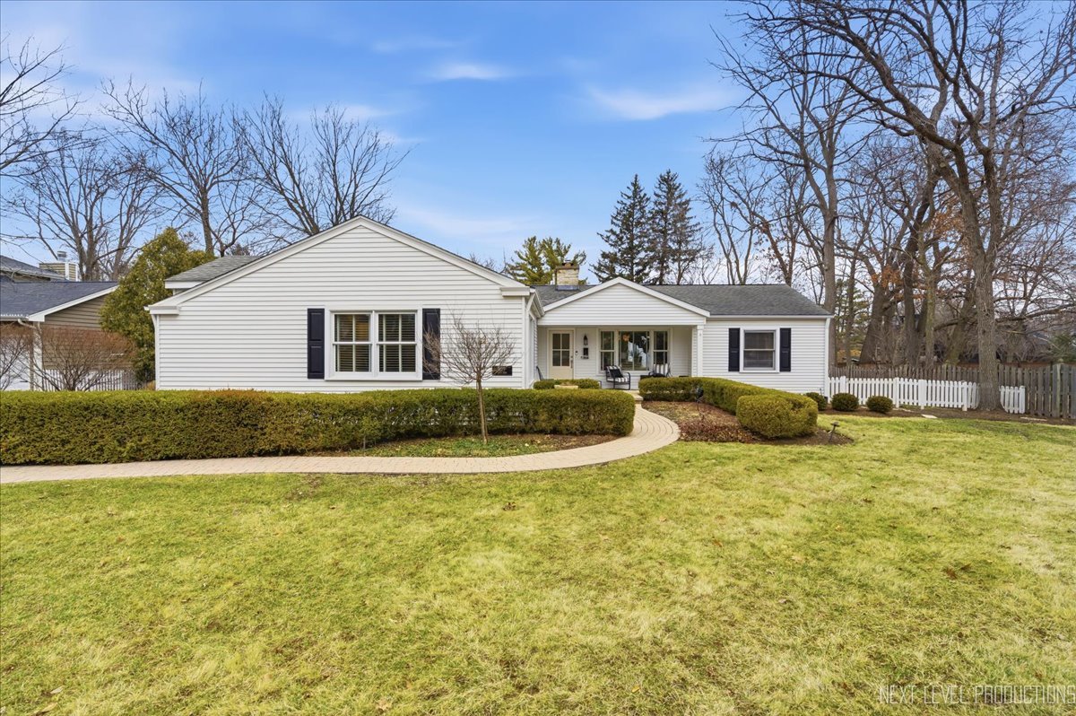 629 Peck Road Geneva, IL 60134 - Photo 2 of 38 a front view of a house with a yard