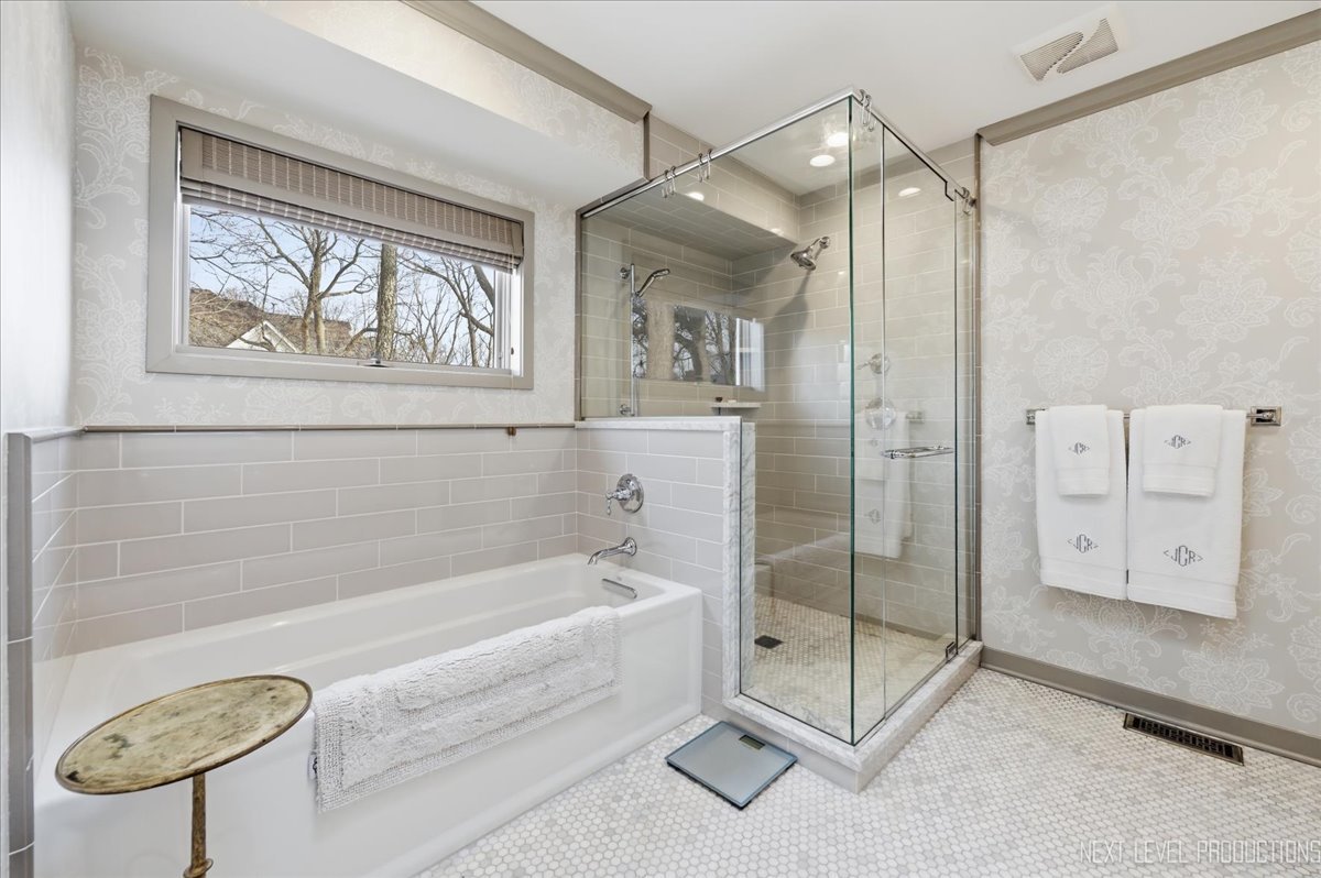 629 Peck Road Geneva, IL 60134 - Photo 21 of 38 a bathroom with a tub and a shower