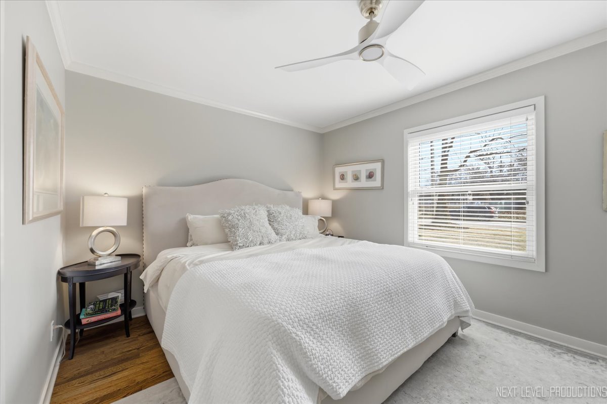 629 Peck Road Geneva, IL 60134 - Photo 23 of 38 a bedroom with a bed and a window