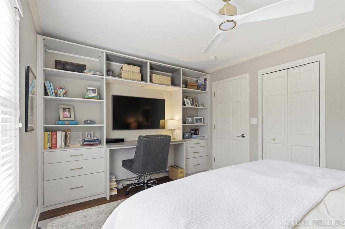 629 Peck Road Geneva, IL 60134 - Photo 24 of 38 a bedroom with a bed and a flat screen tv