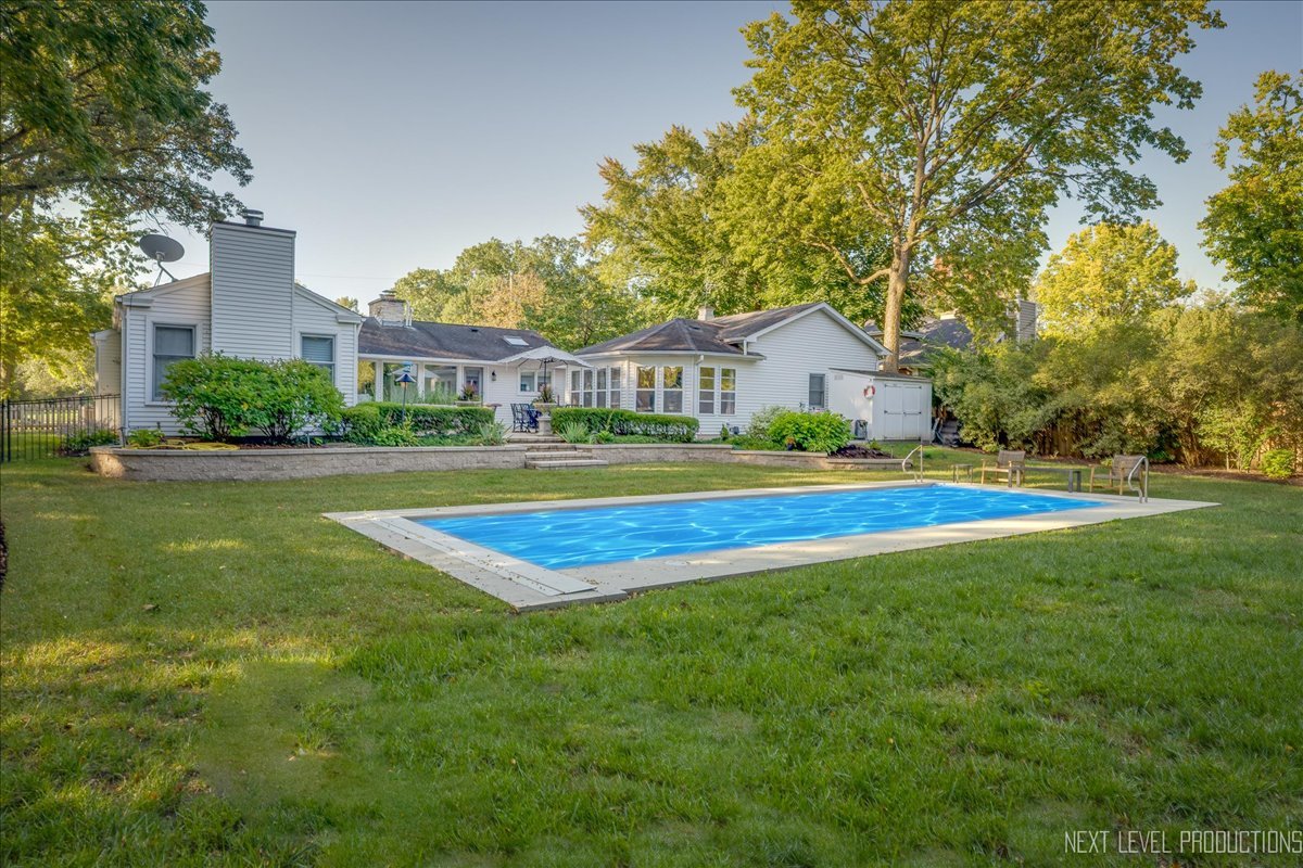 629 Peck Road Geneva, IL 60134 - Photo 34 of 38 a view of house with a swimming pool