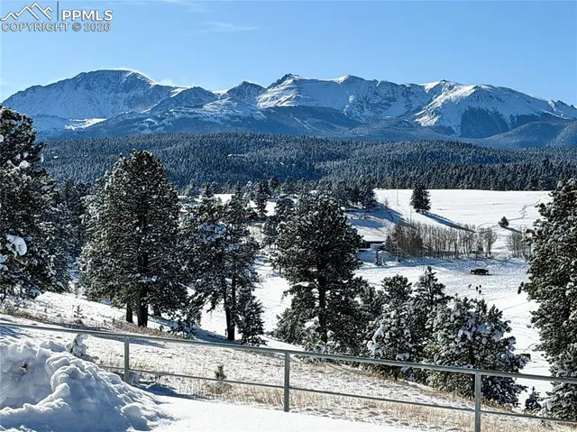 a view of a house with a mountain