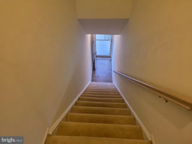 a backyard of a house with lots of green space and trees