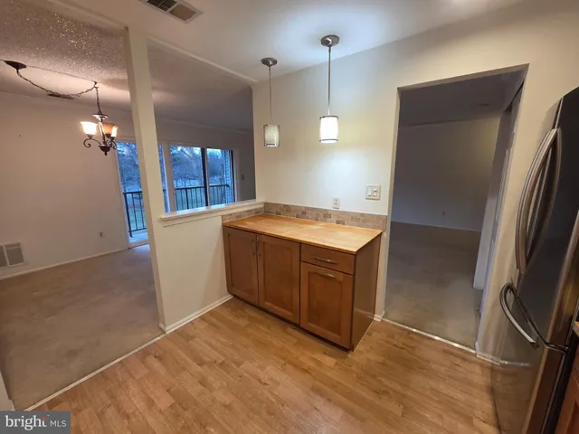 a kitchen with a refrigerator and countertop
