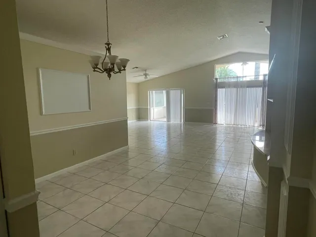 a open kitchen with cabinets and stainless steel appliances