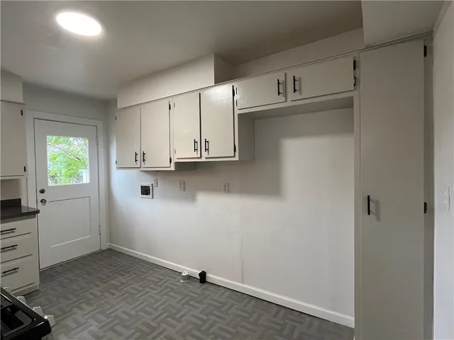 a view of cabinets and window