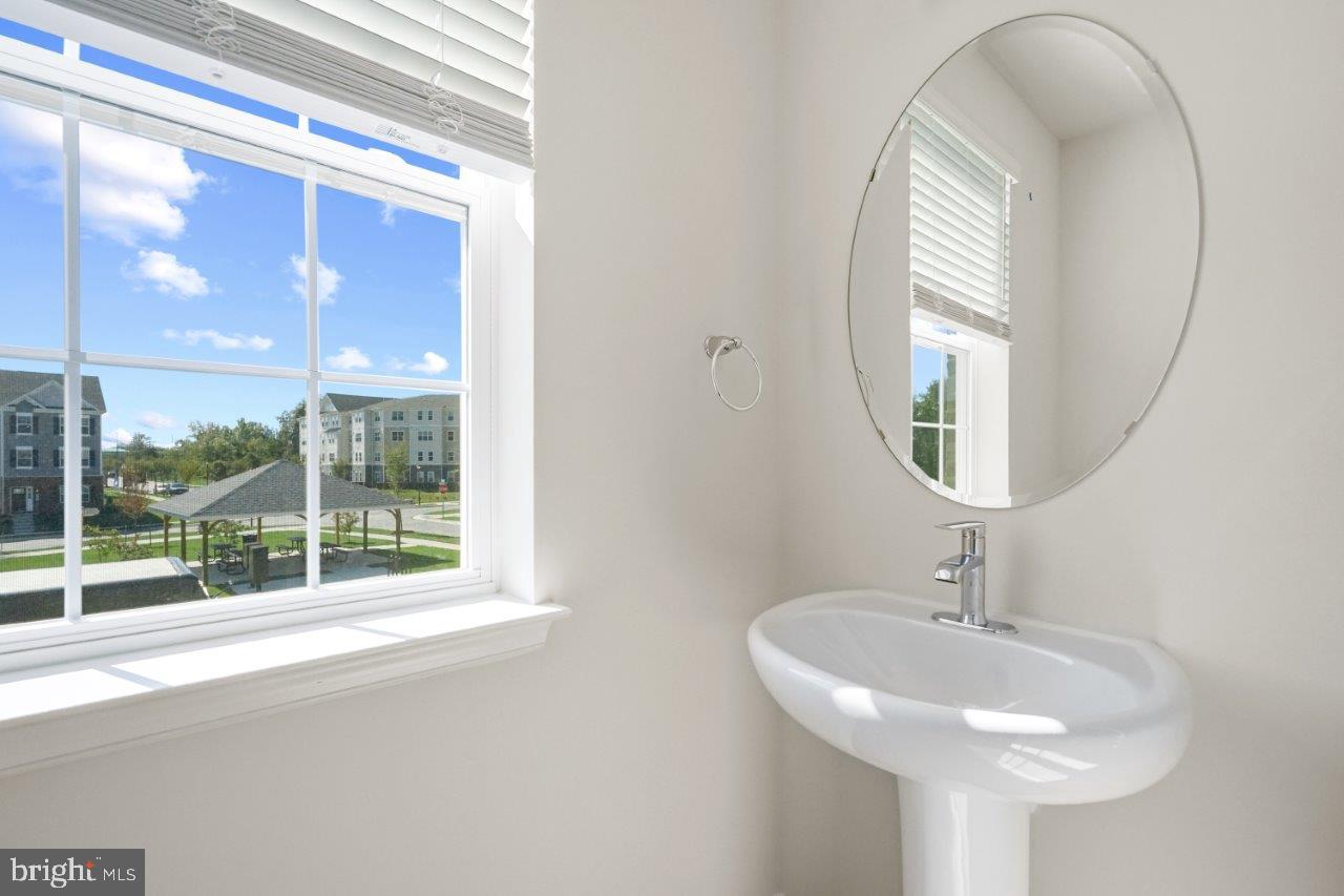7519 Silver Thread Way Brandywine, MD 20613 - Photo 11 of 32 a bathroom with a sink and a mirror