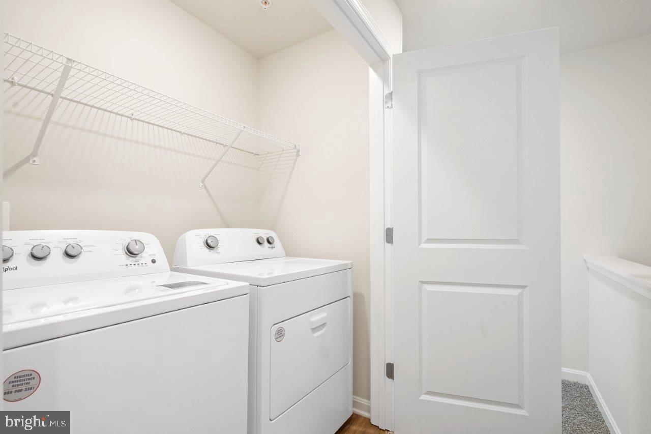 7519 Silver Thread Way Brandywine, MD 20613 - Photo 17 of 32 a view of storage and utility room with washer and dryer