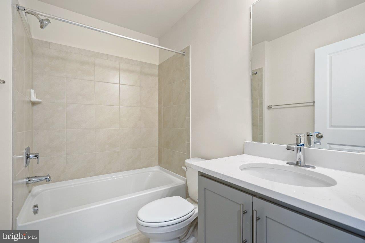 7519 Silver Thread Way Brandywine, MD 20613 - Photo 18 of 32 a bathroom with a sink toilet and shower