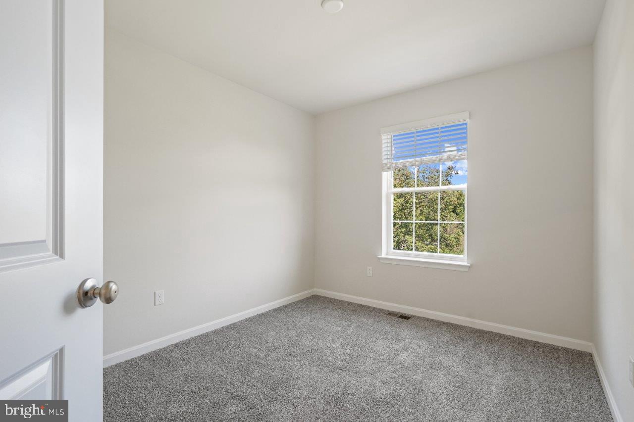 7519 Silver Thread Way Brandywine, MD 20613 - Photo 22 of 32 an empty room with a window