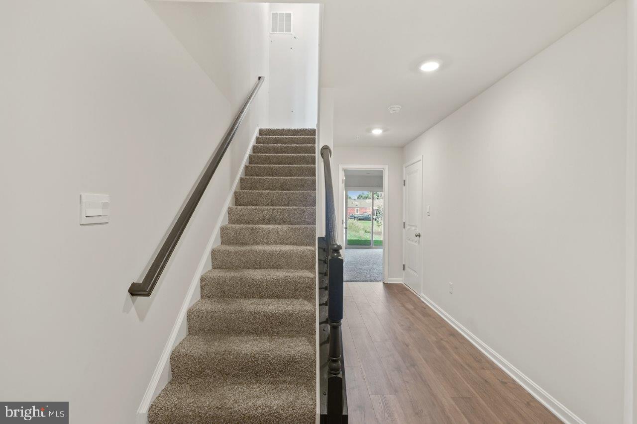 7519 Silver Thread Way Brandywine, MD 20613 - Photo 5 of 32 a view of entryway and hall with wooden floor