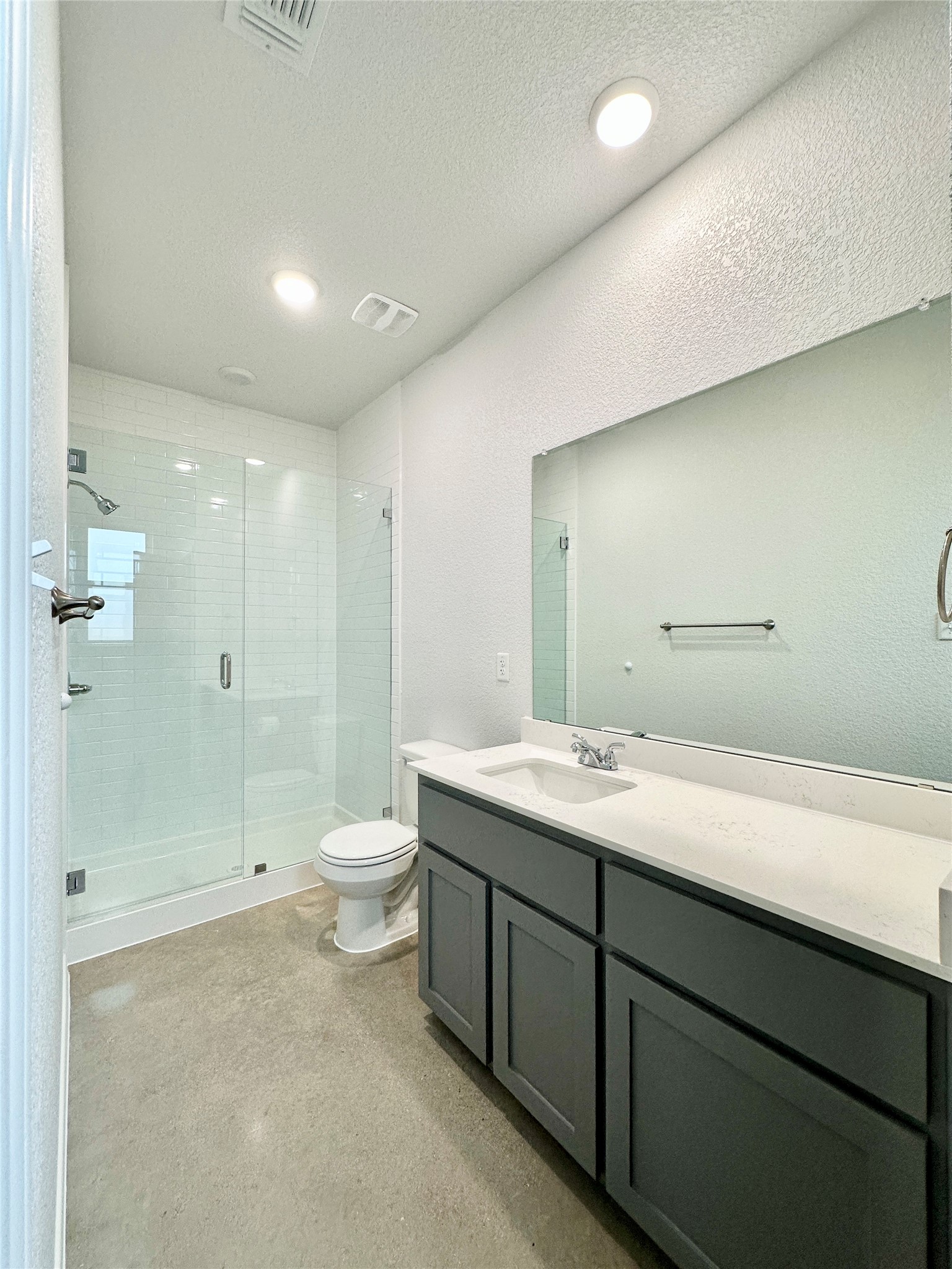 2321 Ocean Avenue, Unit B Temple, TX 76501 - Photo 17 of 19 a bathroom with a granite countertop sink a toilet and shower