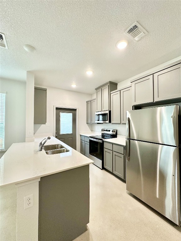 2321 Ocean Avenue, Unit B Temple, TX 76501 - Photo 5 of 19 a kitchen with a refrigerator a stove a sink and white cabinets