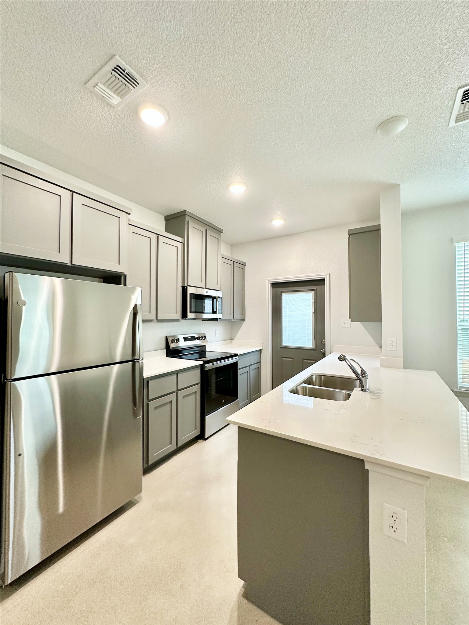2321 Ocean Avenue, Unit B Temple, TX 76501 - Photo 6 of 19 a kitchen with a sink a stove and refrigerator