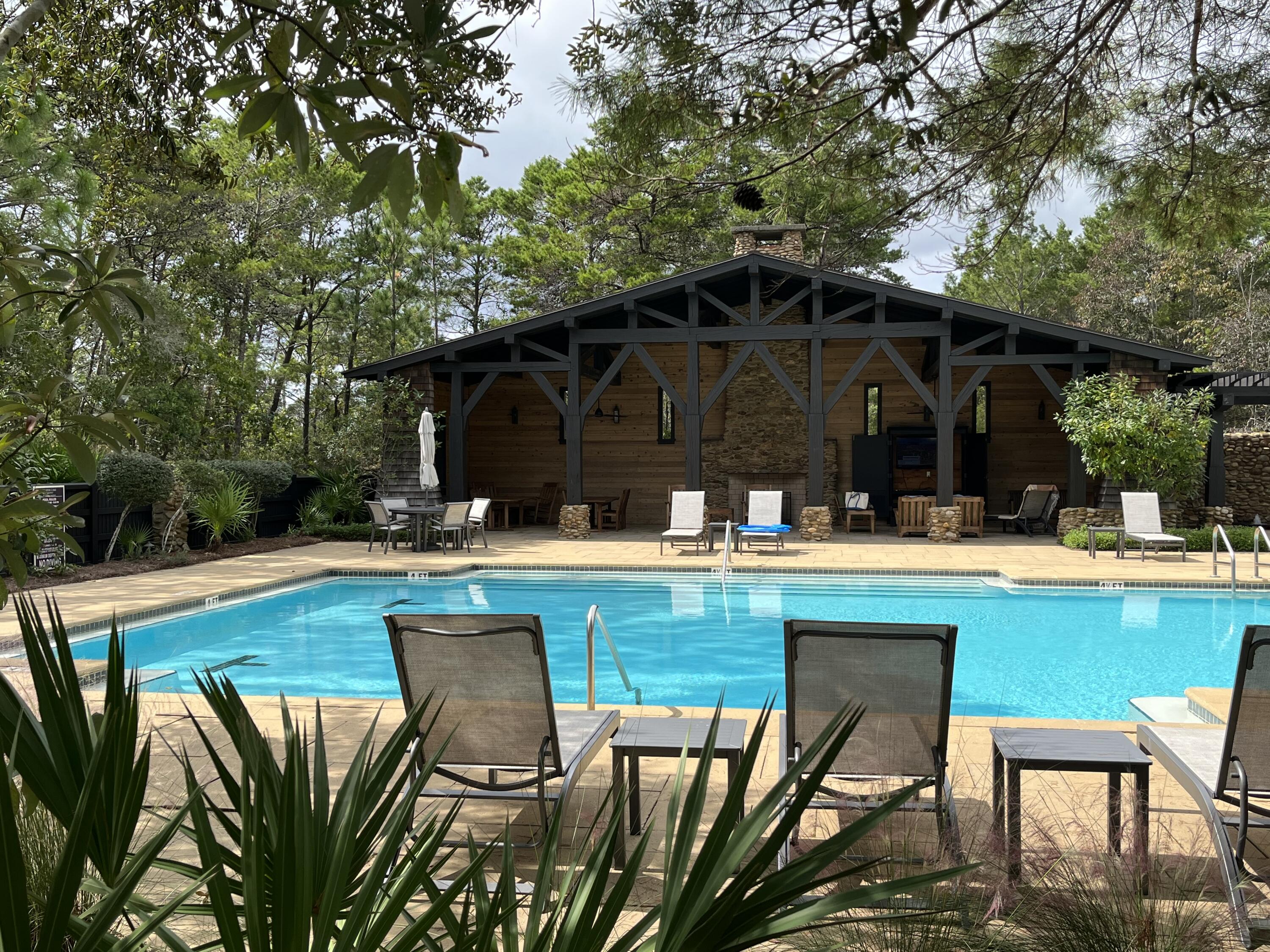 2-4 West Cedar Bend Road Santa Rosa Beach, FL 32459 - Photo 5 of 14 a view of swimming pool with outdoor seating space
