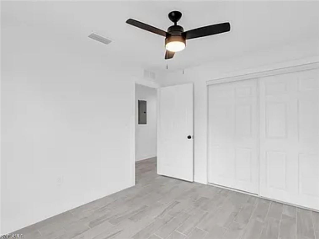 3120 Peters Avenue Naples, FL 34112 - Photo 9 of 12 wooden floor in an empty room