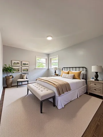 a spacious bedroom with a bed and window